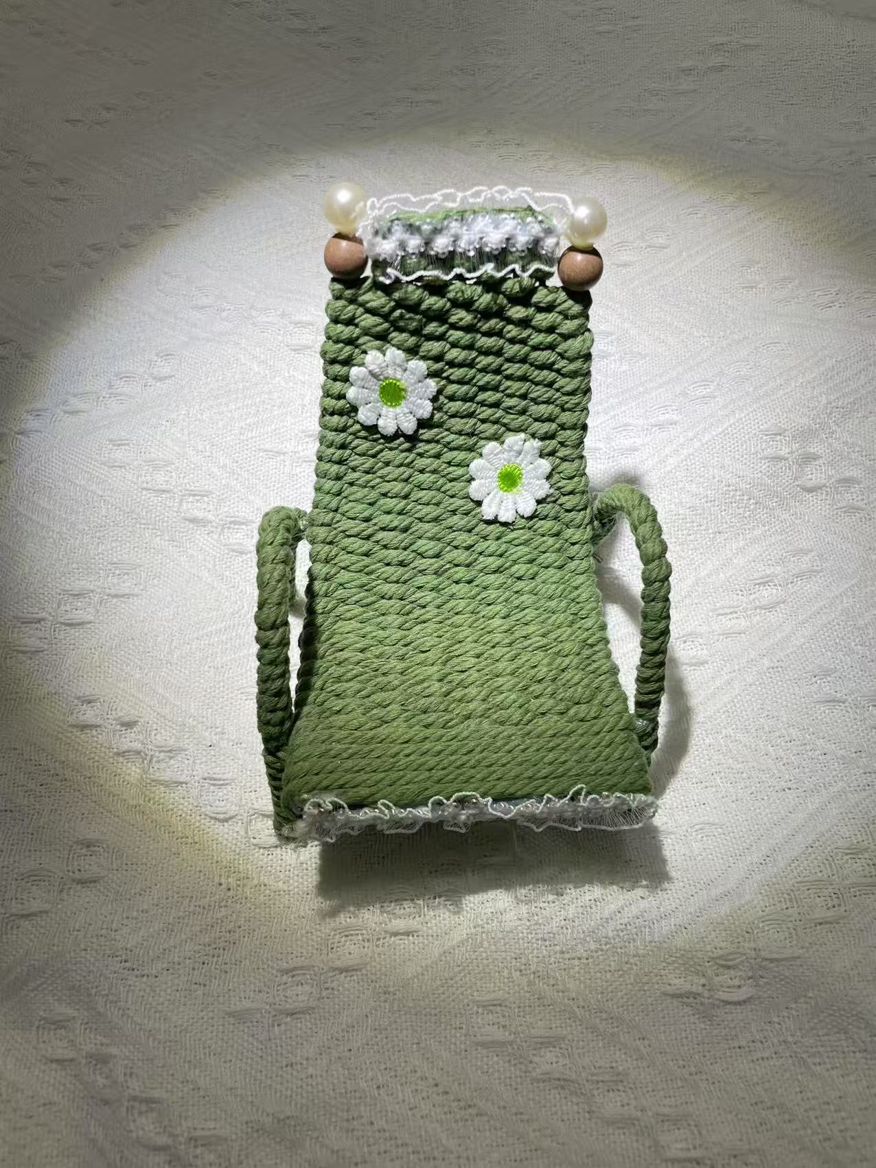 Hand woven chair shaped phone holder