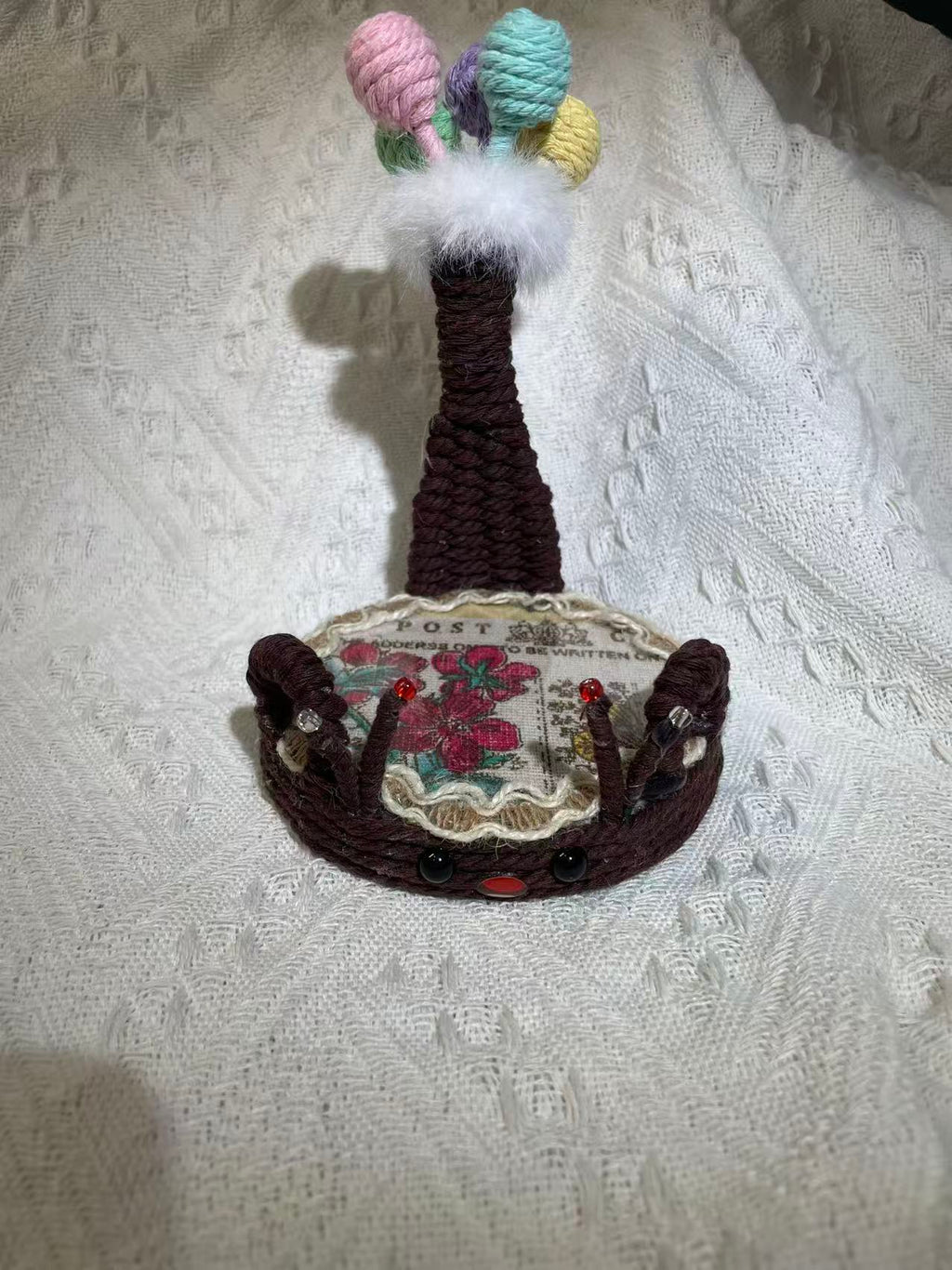 Hand woven fawn shaped phone holder