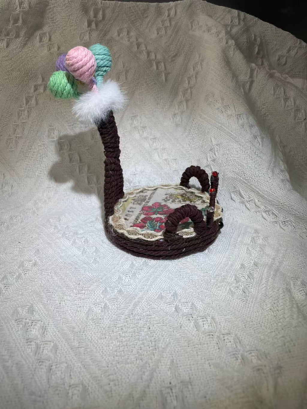 Hand woven fawn shaped phone holder