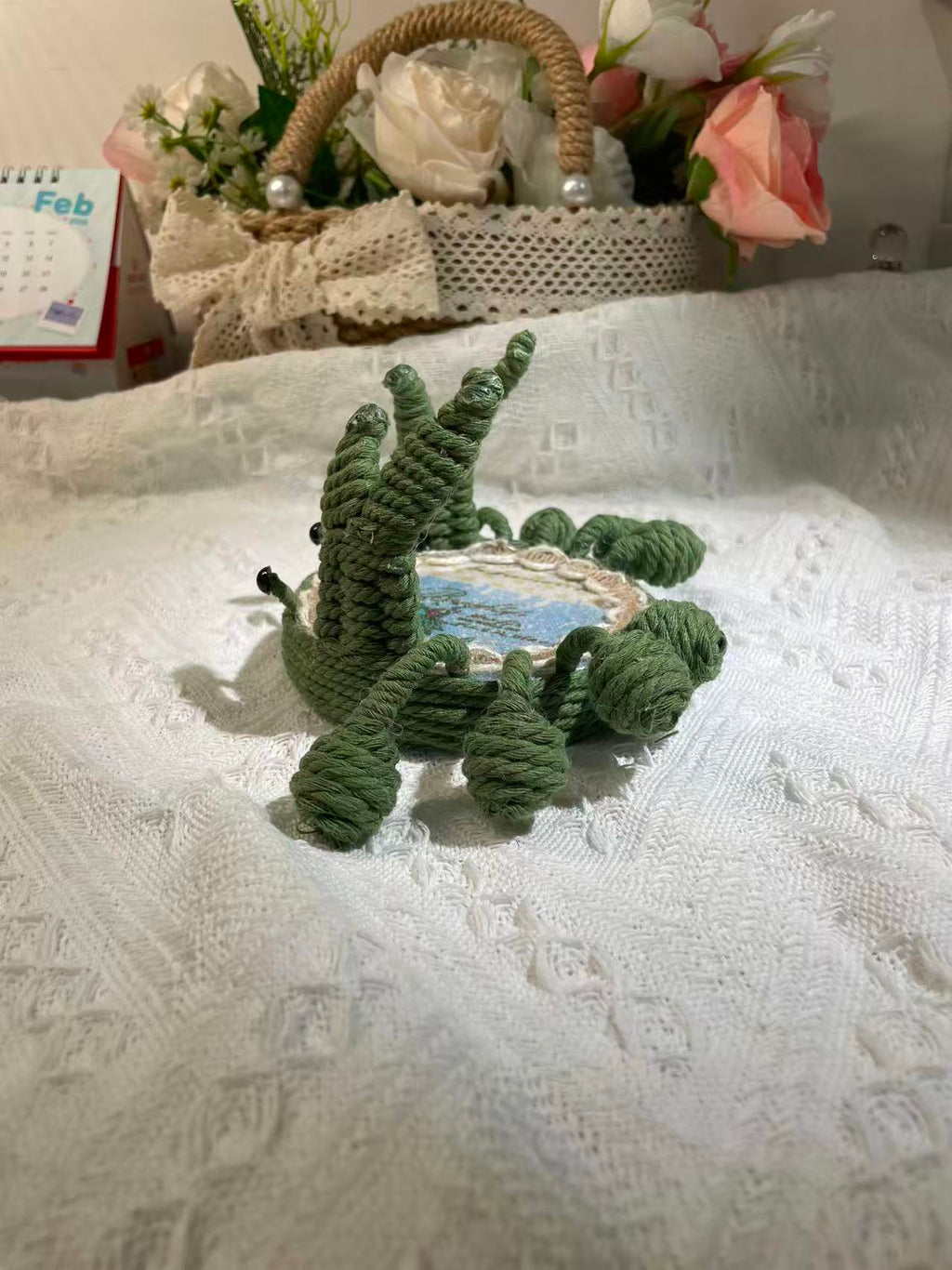 Handwoven crab-shaped phone holder