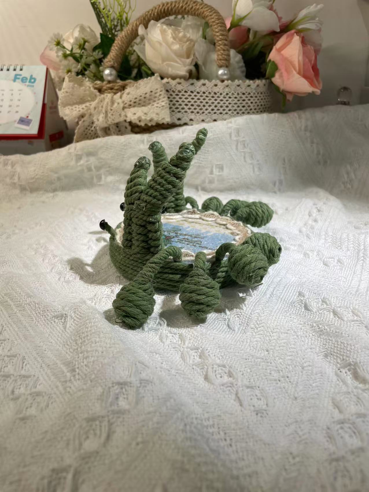 Handwoven crab-shaped phone holder