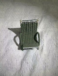 Hand woven chair shaped phone holder