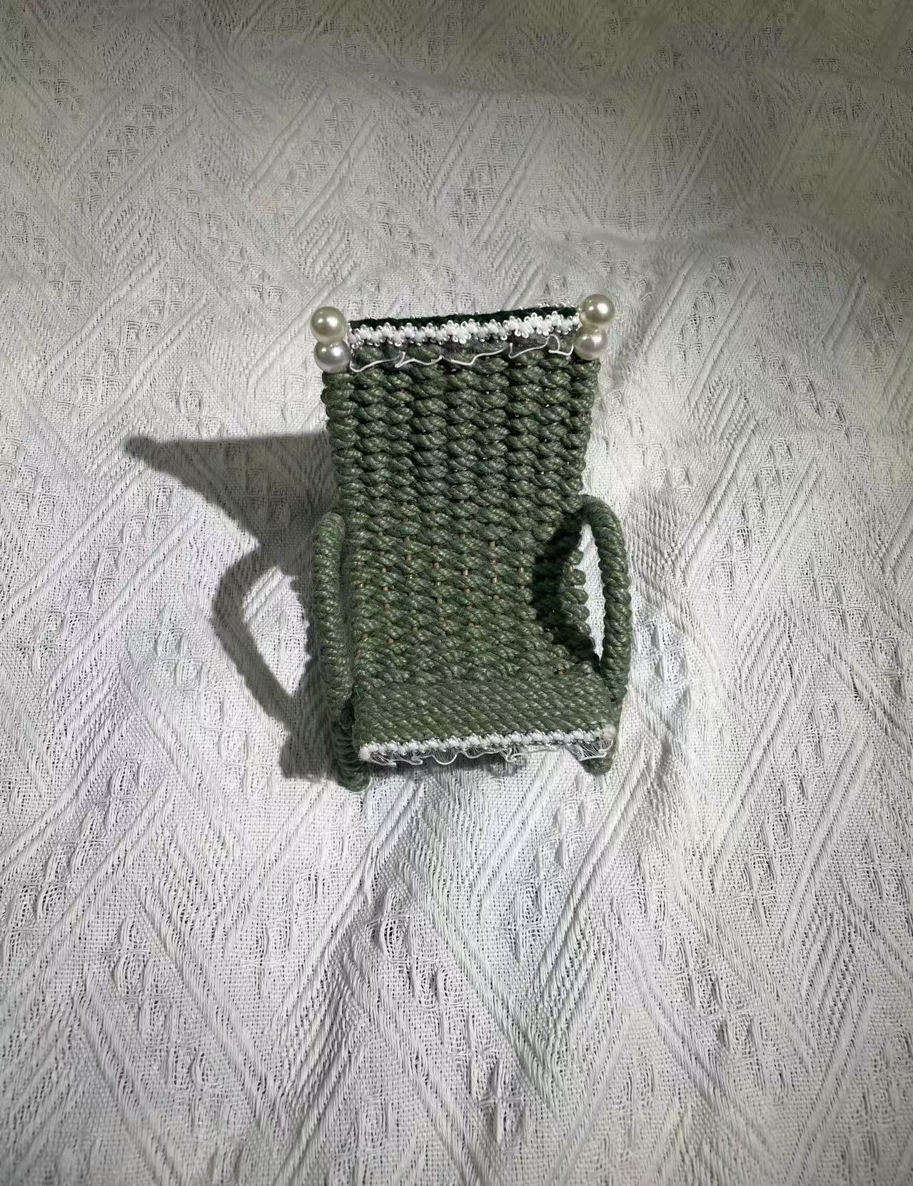 Hand woven chair shaped phone holder